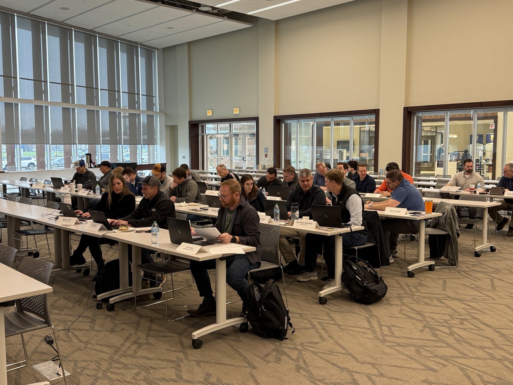 A full room of contractors attending an AI workshop A full room of contractors attending an AI workshop